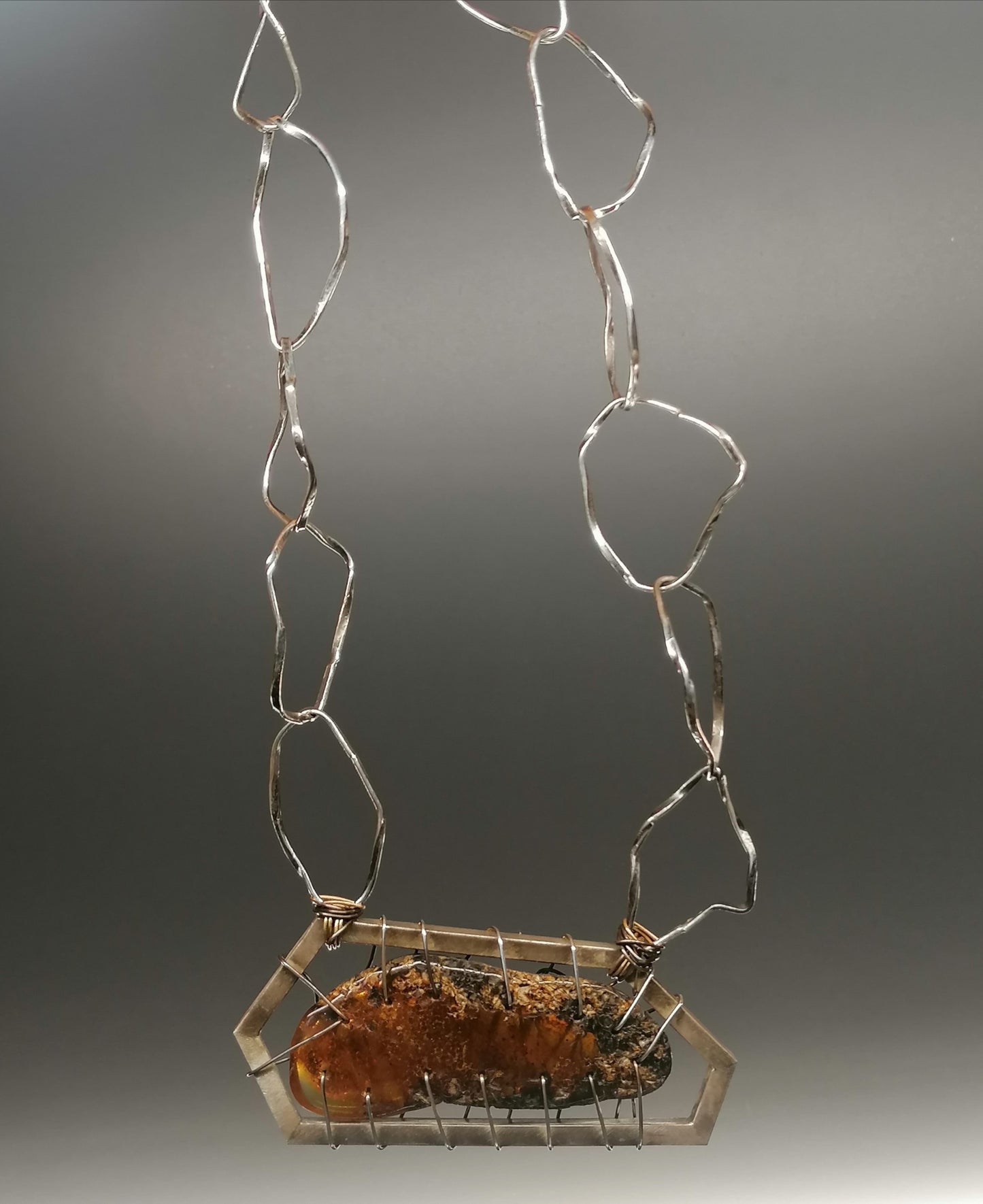 A unique silver necklace with amber