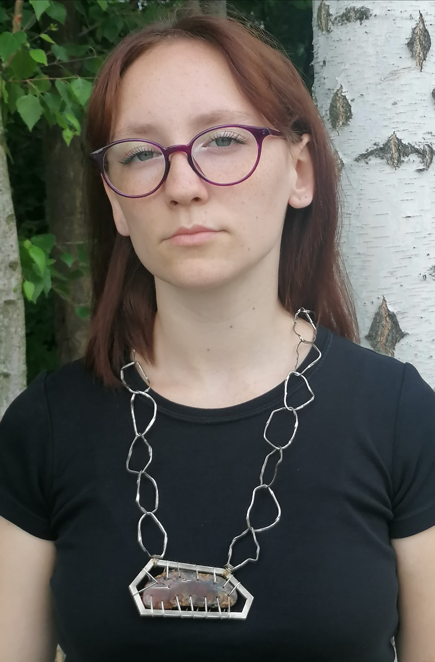 A unique silver necklace with amber
