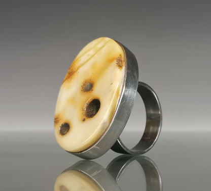 Large ring with milky amber.