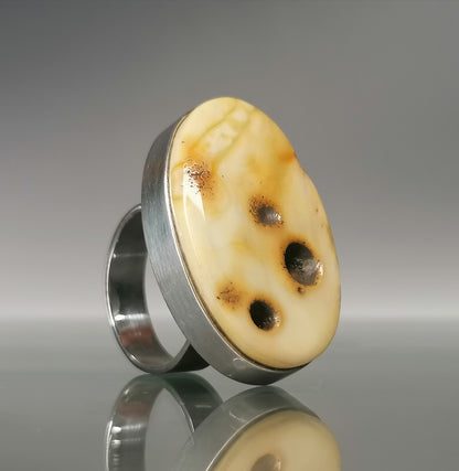 Large ring with milky amber.