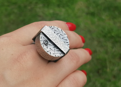 Large silver ring with a synthetic emerald