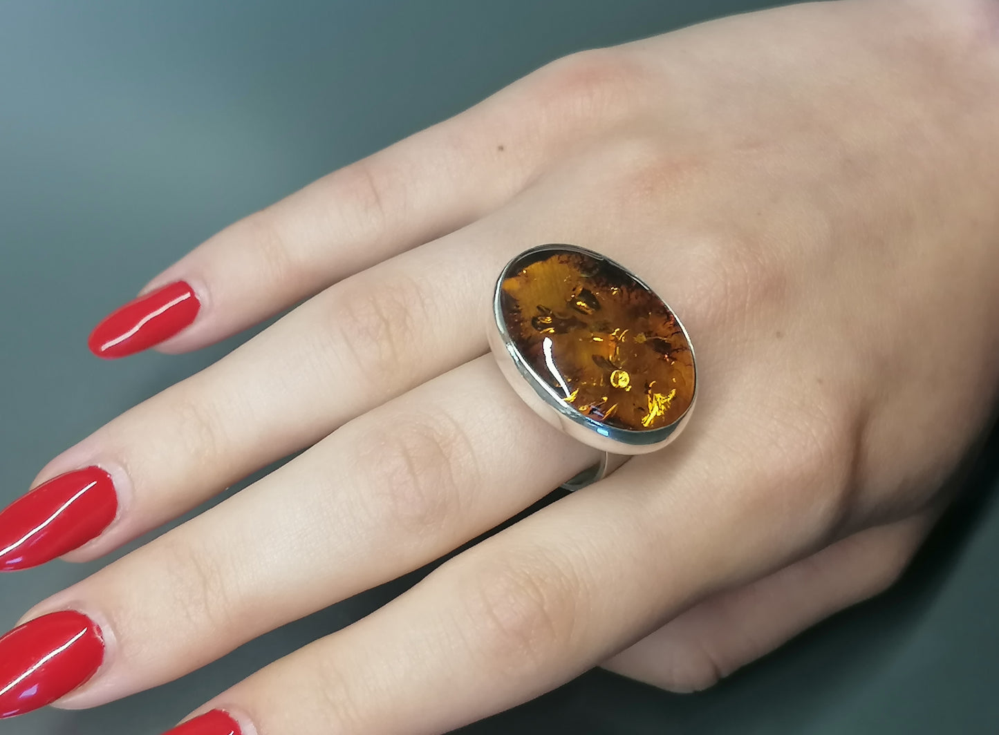 Silver ring with oval amber 