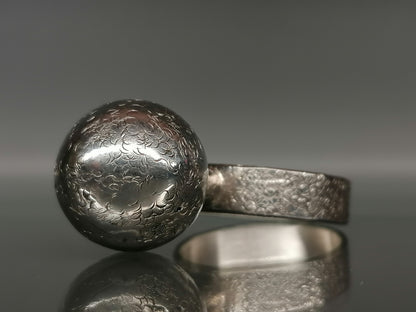 Silver ring with a ball 