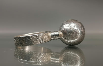 Silver ring with a ball 