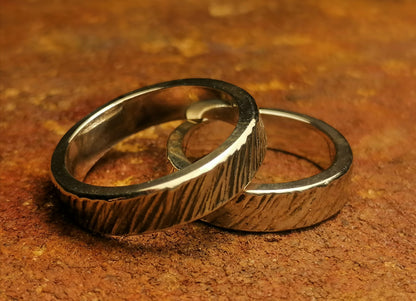 A set of silver craft wedding rings 