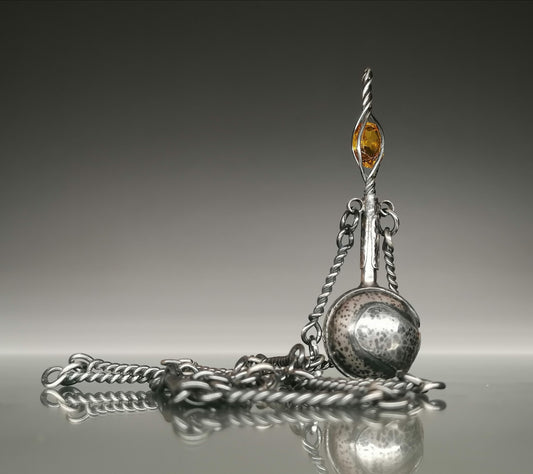 A sophisticated perfume bottle-necklace 