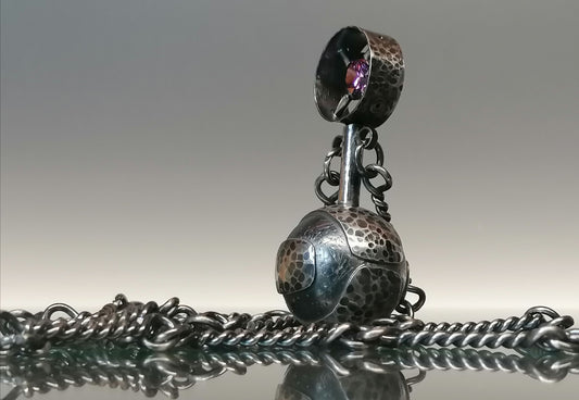 A phenomenal necklace - a perfume bottle 